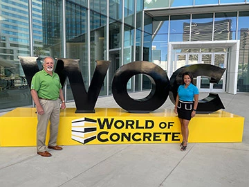 World of Concrete sign with Jim and Duong